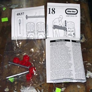 Hardware Bag: 2- 2 1/2 inch Screws. 3 Red Screw Covers and Instruction Sheet