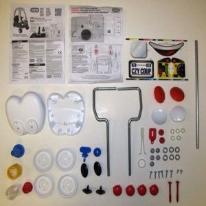 Hardware Pack: Hubcaps. Center Caps. Steering Wheel Retaining Clip. Wireforms (Left & Right). Axle. Key. Decals. Screws. Washers. Bushings. Top Hat. Top Hat Tool. Spacer. Headlights. Taillights. Latch. Steering Wheel O-Ring. Eyes. Fastener Buttons. Igniti